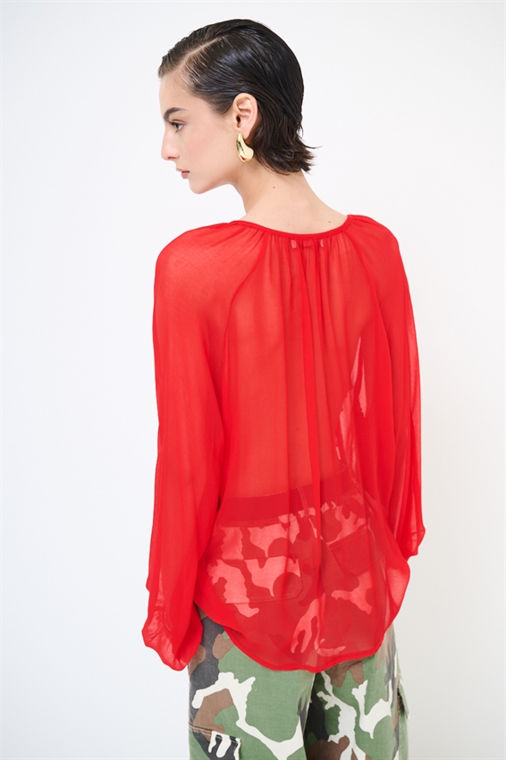 BLUSA CON BOTTONI E VOLANT