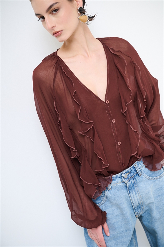 BLUSA CON BOTTONI E VOLANT