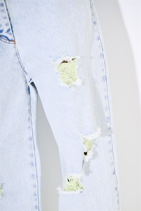 JEANS MARMORIZZATO CON STRAPPI E INTERNO FLUO GIALLO