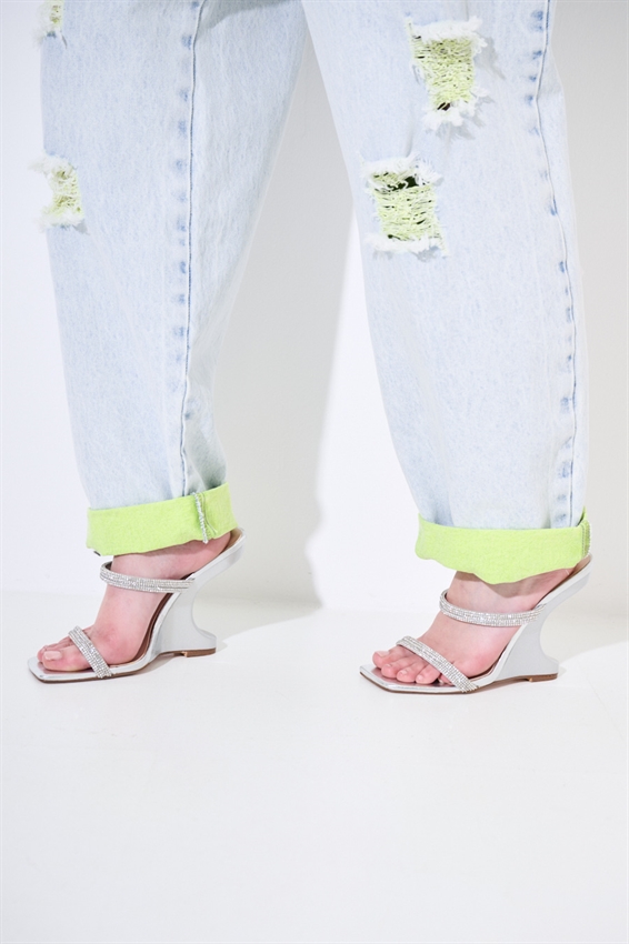 JEANS MARMORIZZATO CON STRAPPI E INTERNO FLUO GIALLO
