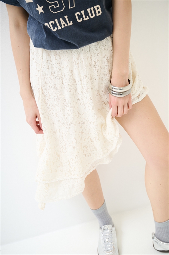 GONNA ASIMMETRICA IN PIZZO CON DOPPIA BALZA