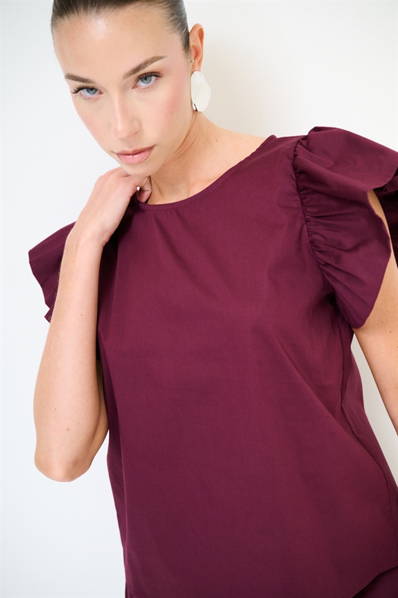 TOP SMANICATO CON DOPPIA GALA