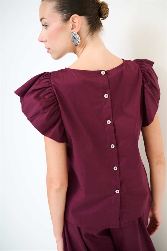 TOP SMANICATO CON DOPPIA GALA
