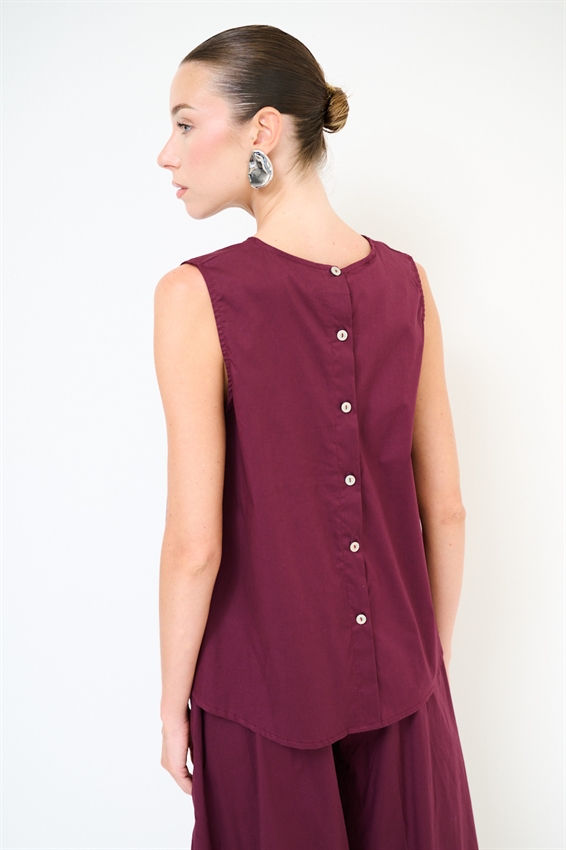 TOP SMANICATO CON BOTTONI DIETRO