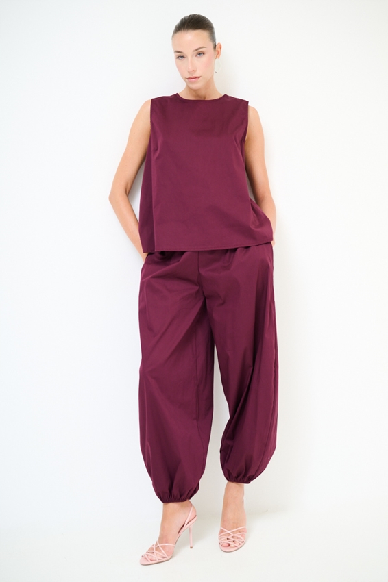 TOP SMANICATO CON BOTTONI DIETRO