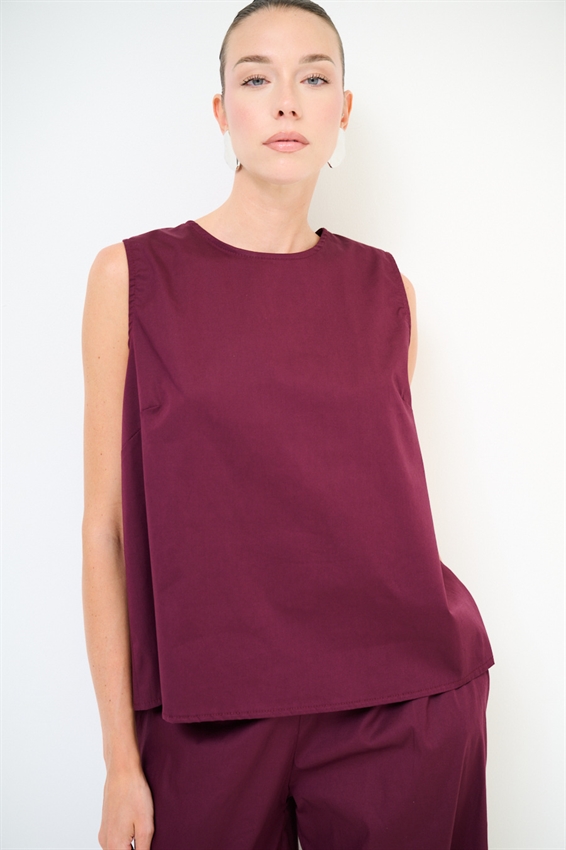 TOP SMANICATO CON BOTTONI DIETRO
