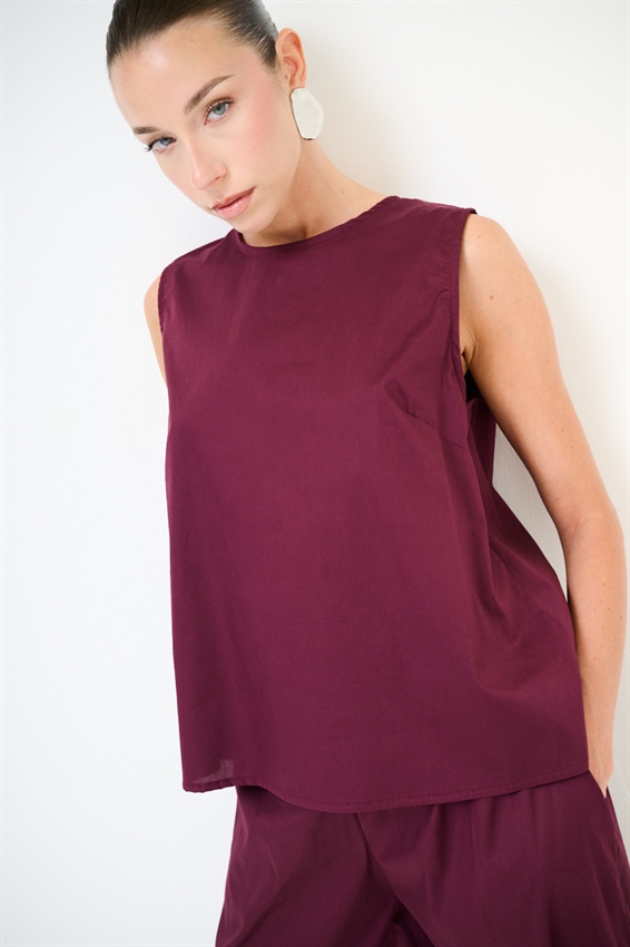 TOP SMANICATO CON BOTTONI DIETRO