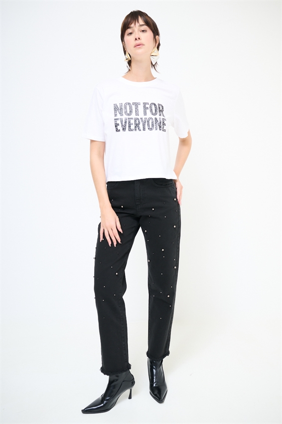 JEANS NERO CON BORCHIE E FONDO TAGLIO VIVO