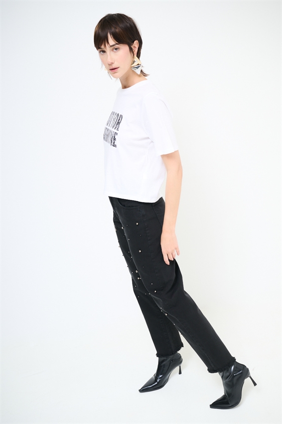 JEANS NERO CON BORCHIE E FONDO TAGLIO VIVO